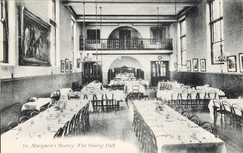 P A Buchanan post card of St Margaret's School, Bushey, Hertfordshire. The Dining Room, with long tables laid for a meal