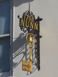 Old Shop Sign on wall of Hertford Museum