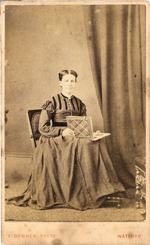 Lady with Photoalbum - by Frederick Downer, Watford